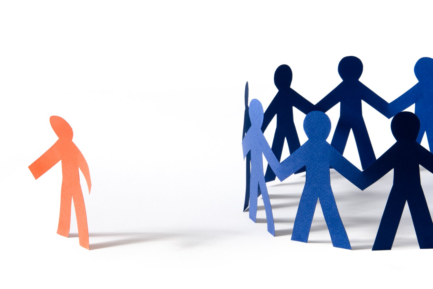 Illustration of cutout people in a circle with one standing to the side to illustrate feeling lonely